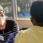 A healthcare worker provides a vaccine to a patient